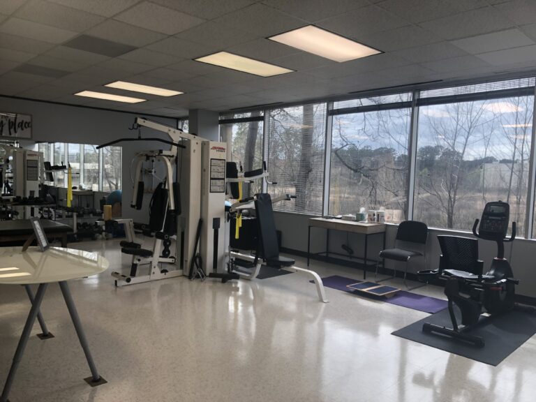 Clinic space inside Option1 featuring equipment for strength and rehab